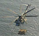 CH-53s refueling with 2 HMMWVs underslung
