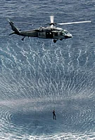 MH-60S Hoists SAR Swimmer