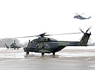 NH90 & EC665 on tarmac, CH-53GA flies