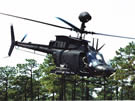 AIR_OH-58D_Kiowa_Warrior_In_Trees.jpg